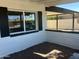 Charming front porch featuring white brick, dark shutters, and gravel accents creating a welcoming curb appeal at 1309 E Julie Dr, Tempe, AZ 85283