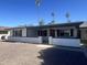 A well-maintained single-story home with a classic desert landscape and a cozy front porch at 1309 E Julie Dr, Tempe, AZ 85283