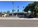 A single-story home with desert landscaping, a carport, and mature shade trees at 1309 E Julie Dr, Tempe, AZ 85283