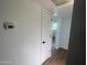 Hallway with view of an open doorway and a thermostat at 1309 E Julie Dr, Tempe, AZ 85283