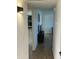 Hallway view with dark wood-look flooring, leading to the living room at 1309 E Julie Dr, Tempe, AZ 85283