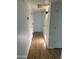 Hallway view with wood-look floors and neutral colors at 1309 E Julie Dr, Tempe, AZ 85283