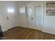 Hallway view shows wood-look floors and white doors at 1309 E Julie Dr, Tempe, AZ 85283