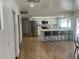 Beautiful kitchen with stainless appliances, white cabinets, island, and barstool seating at 1309 E Julie Dr, Tempe, AZ 85283