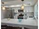 Kitchen features quartz countertops, stainless appliances and modern pendant lighting at 1309 E Julie Dr, Tempe, AZ 85283