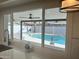 Kitchen window view of the beautiful backyard featuring a sparkling pool and desert landscaping at 1309 E Julie Dr, Tempe, AZ 85283