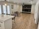 Open concept living area with a fireplace, eat in kitchen, and new flooring at 1309 E Julie Dr, Tempe, AZ 85283