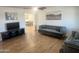 Spacious living room with modern furniture and wood-look floors at 1309 E Julie Dr, Tempe, AZ 85283