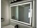 Bright, illuminated mirror enhances the bathroom, creating a modern, well-lit vanity area with easy-to-use touch controls at 1309 E Julie Dr, Tempe, AZ 85283