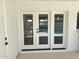 View of backyard pool area from the covered patio through white frame sliding glass doors at 1309 E Julie Dr, Tempe, AZ 85283