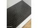 Shower floor with unique honeycomb black tiling at 1309 E Julie Dr, Tempe, AZ 85283