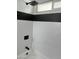 Close-up of the shower-tub with rainfall shower head and white subway tiles at 1309 E Julie Dr, Tempe, AZ 85283