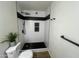 Modern shower with black hardware, white tile, and decorative plant at 1309 E Julie Dr, Tempe, AZ 85283