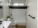 Clean and modern shower-tub combo with white subway tiles at 1309 E Julie Dr, Tempe, AZ 85283