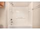 Close-up of the bath and shower combination in the bathroom with tile surround and shower head at 1331 W Baseline Rd # 167, Mesa, AZ 85202