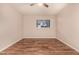 Bedroom with a ceiling fan and window with plantation blinds at 1331 W Baseline Rd # 167, Mesa, AZ 85202