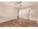 A secondary bedroom with updated plank floors and access to additional rooms at 1331 W Baseline Rd # 167, Mesa, AZ 85202