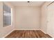 Bedroom featuring wood floors, a window providing natural light, and a large closet with white doors at 1331 W Baseline Rd # 167, Mesa, AZ 85202