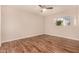 Bedroom featuring ceiling fan, window with view, and neutral walls at 1331 W Baseline Rd # 167, Mesa, AZ 85202
