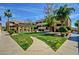 Exterior view of the courtyard featuring a pathway, grassy area, mature landscaping and building facade at 1331 W Baseline Rd # 167, Mesa, AZ 85202