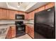 A clean kitchen featuring black appliances and ample cabinet space at 1331 W Baseline Rd # 167, Mesa, AZ 85202