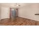 Comfortable living room featuring hardwood floors, a ceiling fan, and access to a private patio at 1331 W Baseline Rd # 167, Mesa, AZ 85202