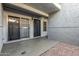 Private patio with a sliding glass door, a black door, and gravel, offering a tranquil outdoor retreat at 1331 W Baseline Rd # 167, Mesa, AZ 85202