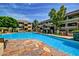 A stunning community pool with comfortable lounge chairs, lush landscaping, and inviting blue water to enjoy at 1331 W Baseline Rd # 167, Mesa, AZ 85202