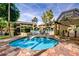 Hot tub is featured in a common area with lush landscaping, shaded seating and an inviting swimming area at 1331 W Baseline Rd # 167, Mesa, AZ 85202