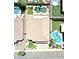 Aerial view of a home's backyard featuring mature landscaping, pools, and a putting green at 15229 S 18Th Dr, Phoenix, AZ 85045