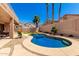 Backyard featuring a pool, turfed lawn, and desert landscaping at 15229 S 18Th Dr, Phoenix, AZ 85045