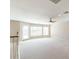 Bright bonus room featuring neutral walls, carpet, a ceiling fan, recessed lighting, and a door leading to a balcony at 15229 S 18Th Dr, Phoenix, AZ 85045