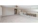 Spacious bonus room with neutral walls, light carpet, and an arched entryway at 15229 S 18Th Dr, Phoenix, AZ 85045