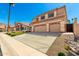 Charming two-story home with a three-car garage and a well-maintained front yard with desert landscaping at 15229 S 18Th Dr, Phoenix, AZ 85045