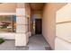 Inviting front entry featuring a decorative iron door and architectural columns at 15229 S 18Th Dr, Phoenix, AZ 85045