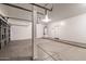 Spacious garage with high ceilings, ample space for vehicles, and a utility area at 15229 S 18Th Dr, Phoenix, AZ 85045