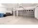 A large three car garage with two car garage doors at 15229 S 18Th Dr, Phoenix, AZ 85045