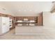 Spacious kitchen featuring an island, stainless steel appliances, and ample wooden cabinetry at 15229 S 18Th Dr, Phoenix, AZ 85045