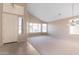 Spacious and bright living room with large windows and neutral decor at 15229 S 18Th Dr, Phoenix, AZ 85045