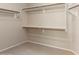 Walk-in closet with carpeted floors and shelving at 15229 S 18Th Dr, Phoenix, AZ 85045