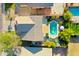 Birds-eye view showcasing a well-maintained home with a swimming pool, mature trees, and a serene backyard at 1750 E Erie St, Gilbert, AZ 85295