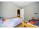 Neutral bedroom with two twin beds, and wood flooring at 1750 E Erie St, Gilbert, AZ 85295