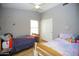 Neutral bedroom with two twin beds, and a ceiling fan for added comfort at 1750 E Erie St, Gilbert, AZ 85295