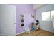 Charming bedroom with a desk, window, and wood flooring at 1750 E Erie St, Gilbert, AZ 85295