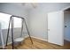 Neutral bedroom with a hanging chair and wood flooring at 1750 E Erie St, Gilbert, AZ 85295