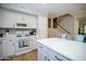 Modern kitchen with white cabinets, stainless steel appliances, and a functional layout at 1750 E Erie St, Gilbert, AZ 85295