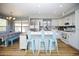 Eat-in kitchen with white cabinets, stainless appliances, and a dining nook at 1750 E Erie St, Gilbert, AZ 85295