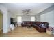 Comfortable living room featuring a large sectional sofa, entertainment center, and natural light at 1750 E Erie St, Gilbert, AZ 85295
