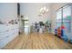 Spacious living room featuring wood floors, a large window, and neutral-toned walls at 1750 E Erie St, Gilbert, AZ 85295