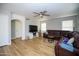Comfortable living room featuring a large sectional sofa, entertainment center, and lots of light at 1750 E Erie St, Gilbert, AZ 85295